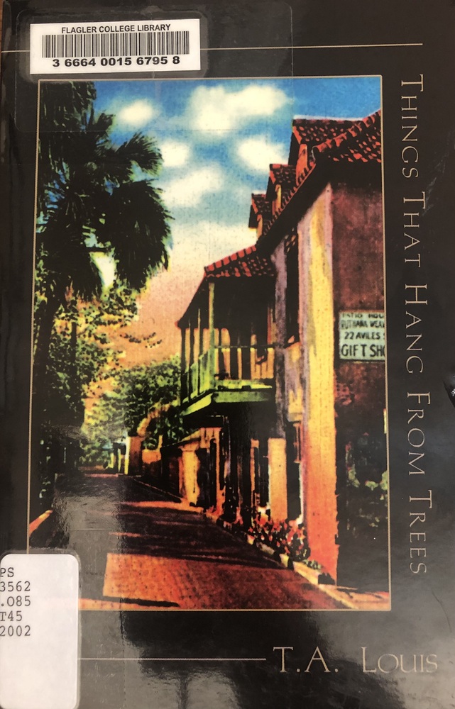 This book is titled "Things that Hang from Trees" by T.A. Louis. The cover of the book depicts a street in downtown St. Augustine with second-floor porches overhanging the street. The cover appears to be a watercolor painting.