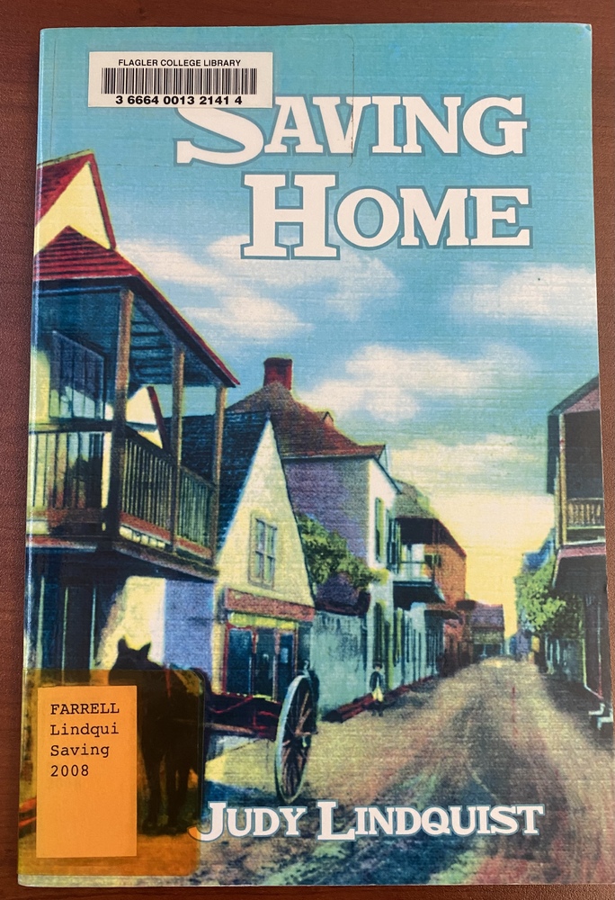 This book is titled "Saving Home" by Judy Lindquist. The cover of this book includes a detailed, colorful illustration of a street in downtown St. Augustine, most likely Aviles Street or Charlotte Street, known for their once narrow, sandy roads and overhanging porches. Additionally, there is a horse and carriage traveling down the road.